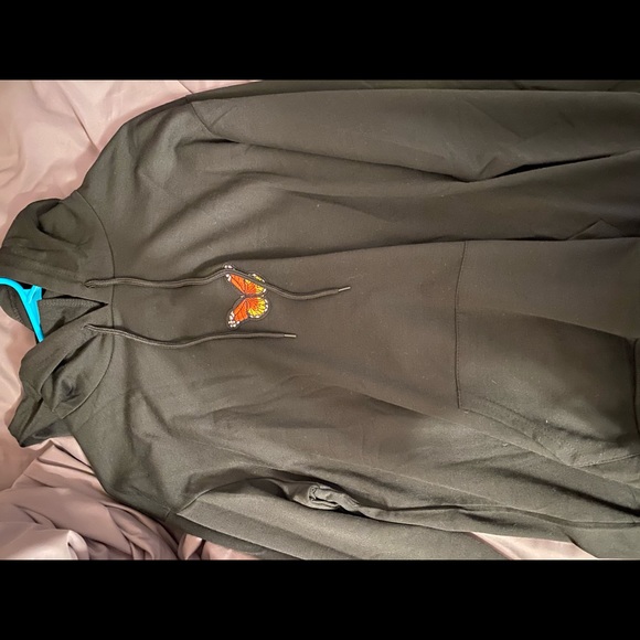 black hoodie with orange butterfly